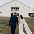 Bride and Groom Walk Together. Bride Wearing Halter Lace Detailer Fit And Flare Wedding Dress Called Kevyn By Sottero And Midgley And A Long Veil
