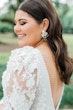 Brunette Bride In Wedding Dress With Floral Puff Sleeves Called Cruz By Sottero And Midgley With Floral Pearl Earrings