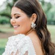 Brunette Bride In Wedding Dress With Floral Puff Sleeves Called Cruz By Sottero And Midgley With Floral Pearl Earrings