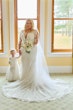 Bride wearing Saige by Maggie Sottero with her flower girl