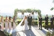 Bride Wearing Lace Fit-n-flare Wedding Dress Called Nyjah By Sottero And Midgley Standing With Groom At The Altar