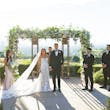 Bride Wearing Lace Fit-n-flare Wedding Dress Called Nyjah By Sottero And Midgley Standing With Groom At The Altar