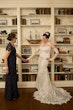 Bride wearing Kern by Maggie Sottero holding hands with her mother