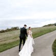 Bride Wearing Lace Backless Wedding Dress Called Chauncey By Sottero And Midgley Walking On A Path With Groom