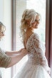 Bride Wearing Lace Princess Wedding Dress Called Norvinia By Sottero And Midgley Getting Buttoned Up