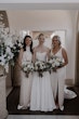 Bride wearing Scarlet by Maggie Sottero with her bridesmaids