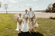 Bride Wearing Crepe Wedding Dress Called Dionne By Rebecca Ingram With Her Family On The Beach