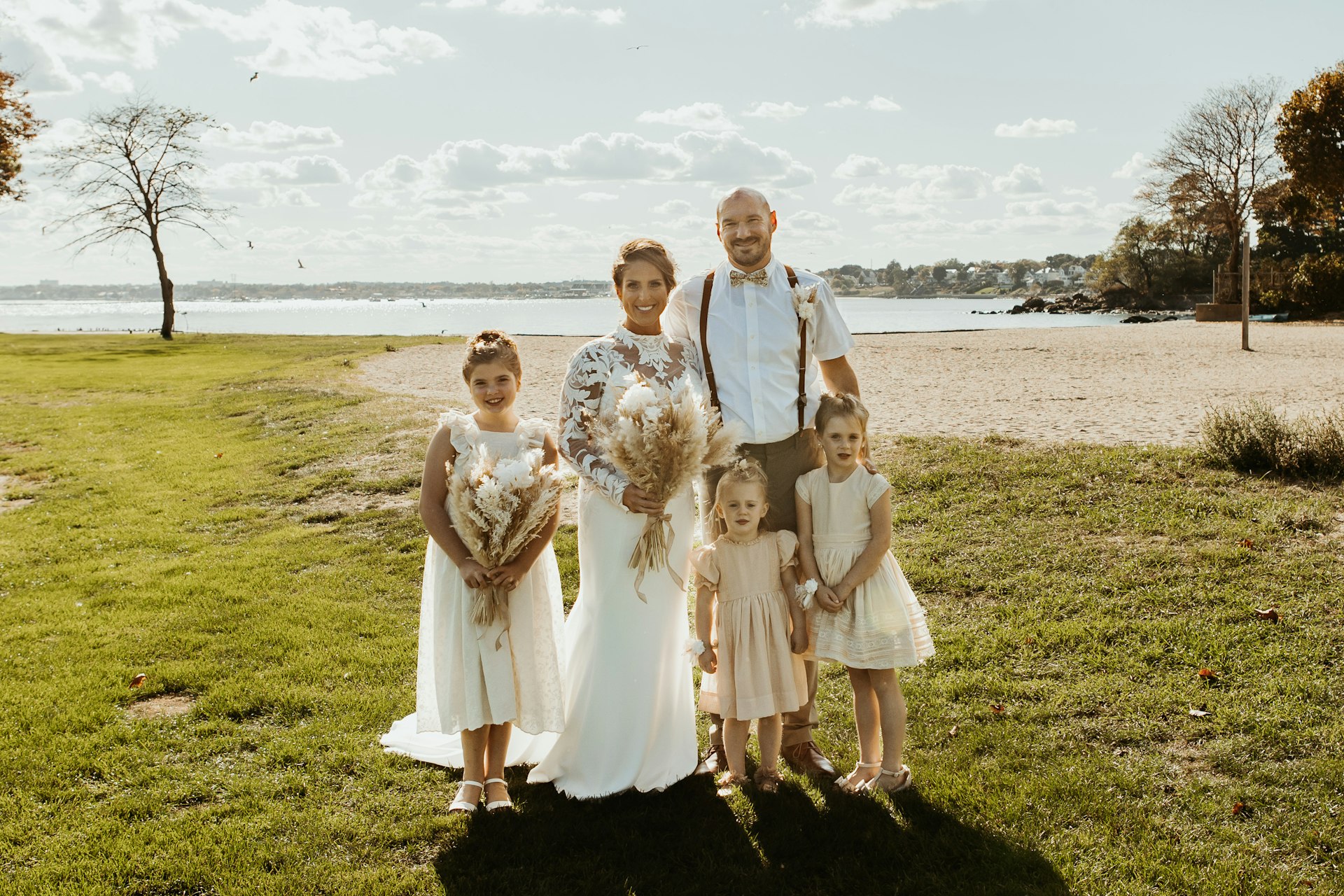 Bride Wearing Crepe Wedding Dress Called Dionne By Rebecca Ingram With Her Family On The Beach