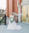 Bride wearing Hattie Lane Marie wedding dress by Rebecca Ingram