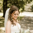 Bride wearing affordable floral ballgown wedding dress.