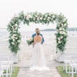 Bride Wearing Boho Sheath Wedding Dress Called Marisol By Rebecca Ingram With Groom On The Beach