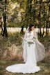 Bride wearing satin sheath wedding dress.