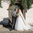 Bride wearing Iris wedding dress by Rebecca Ingram kissing her husband