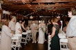 Bride wearing Tuscany Marie wedding dress by Maggie Sottero walking down the aisle