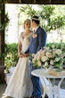 bride in deep v-neckline  wedding dress called roxanne by sottero and midgley with groom