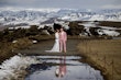 Bride wearing Tuscany Lynette by Maggie Sottero with her husband in the snow