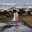 Bride wearing Tuscany Lynette by Maggie Sottero with her husband in the snow
