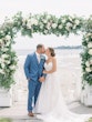 Bride Wearing Boho Sheath Wedding Dress Called Marisol By Rebecca Ingram Kissing Groom