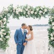 Bride Wearing Boho Sheath Wedding Dress Called Marisol By Rebecca Ingram Kissing Groom