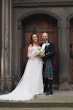 Bride wearing Nerida by Sottero and Midgley with her husband