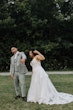 Bride Wearing A-Line Romantic Wedding Dress Called Marlow By Sottero And Midgley Showing Rings With Groom