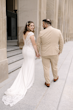 Bride Wearing Crepe Lace Wedding Dress Called Anson By Sottero And Midgley Holding Hands With Groom