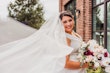 Real Bride Holding Flowers In a White Wedding Dress Named Darius By Maggie Sottero