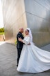 Bride wearing Juniper by Sottero and Midgley with her husband