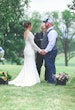 Bride wearing Drita wedding dress by Maggie Sottero at her ring ceremony