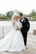 Bride Wearing Lace Princess Wedding Dress Called Norvinia By Sottero And Midgley With Groom On A Pier