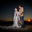 Groom With Bride In White Wedding Dress Named Johanna By Maggie Sottero At Sunset