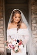 Bride Wearing Sheath Wedding Dress With Pearls Drew Marie By Maggie Sottero