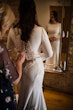 Bride Wearing Simple Keyhole Back Wedding Dress Called Aston By Sottero and Midgley Getting Buttoned Up