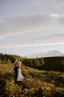 Bride wearing Hilo by Maggie Sottero kissing her husband