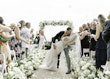 Bride Wearing Pearl Sparkly Bridal Gown Called Drew By Maggie Sottero Kissing Groom