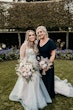 Bride wearing Stevie wedding gown by Maggie Sottero with a bridesmaid