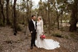 Groom Holding Hands with Bride in VIntage Inspired Puff Sleeve Mermaid Wedding Dress in 3-D Floral Motifs Called Cruz by Sottero & Midgley