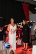 Bride Wearing Crepe Wedding Dress Called Dionne By Rebecca Ingram With Wedding Band Shaking The Tambourine