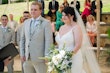 Groom with Real Bride in V-neck Lace Strap Wedding Dress Named Dublin by Sottero & Midgley at the Alter