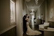 Real Bride in Illusion V-Back Sheath Wedding Gown with Lace Motifs and Side Illusion Panels Called Angie by Rebecca Ingram