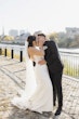 Groom Kissing Bride in Opulent Stretch Satin Vintage Sheath Wedding Dress with Sweetheart Neckline called Yates by Maggie Sottero