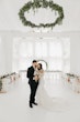 Groom Posing With Bride In Illusion Sheath Floral Wedding Dress Named Angie By Rebecca Ingram