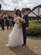 Groom With Bride Wearing Off-The-Shoulder Princess Wedding Dress Mavis By Rebecca Ingram