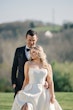 Bride wearing Selena by Maggie Sottero with her husband