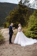 Bride Wearing Lace Aline Wedding Dress Called Harlem By Maggie Sottero With Groom Reading His Vows