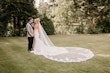 Bride wearing Tuscany Royale by Maggie Sottero embracing her husband