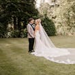 Bride wearing Tuscany Royale by Maggie Sottero embracing her husband