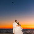 Bride Wearing Boho Sleeved Wedding Dress Called Quintyn By Maggie Sottero Looking At The Moon