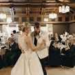 Bride with groom wearing halter ballgown wedding dress.