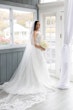 Bride Wearing Sexy Lace Wedding Dress Called Lennon By Maggie Sottero Holding A White Bouquet